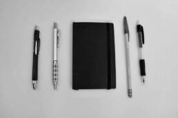 Pocket Notebook between pens and pencils